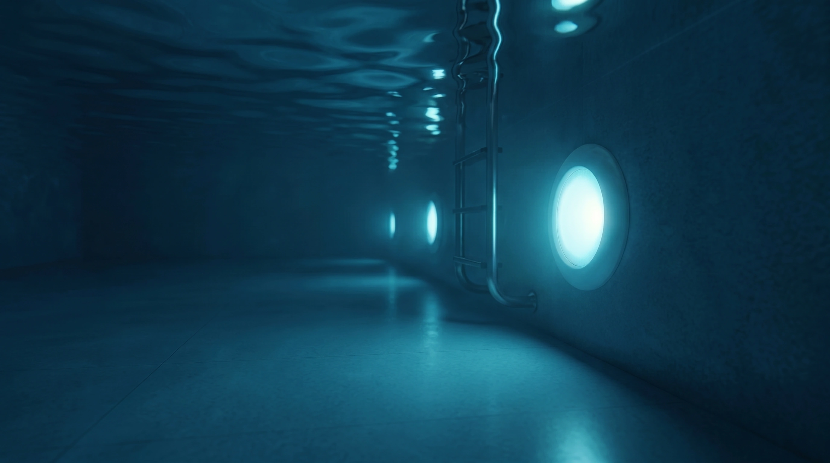 Underwater shot of an LED-lit pool corridor atmosphere